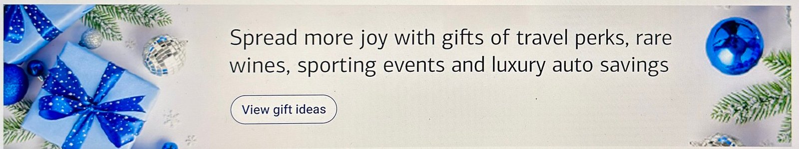 Holiday campaign banner, desktop &mdash; gifts photograph either side of centred copy and a View gift ideas button